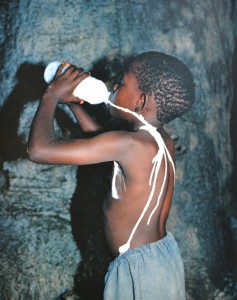 Boy drinking milk from bottle