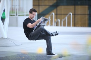 Man sits on invisible chair